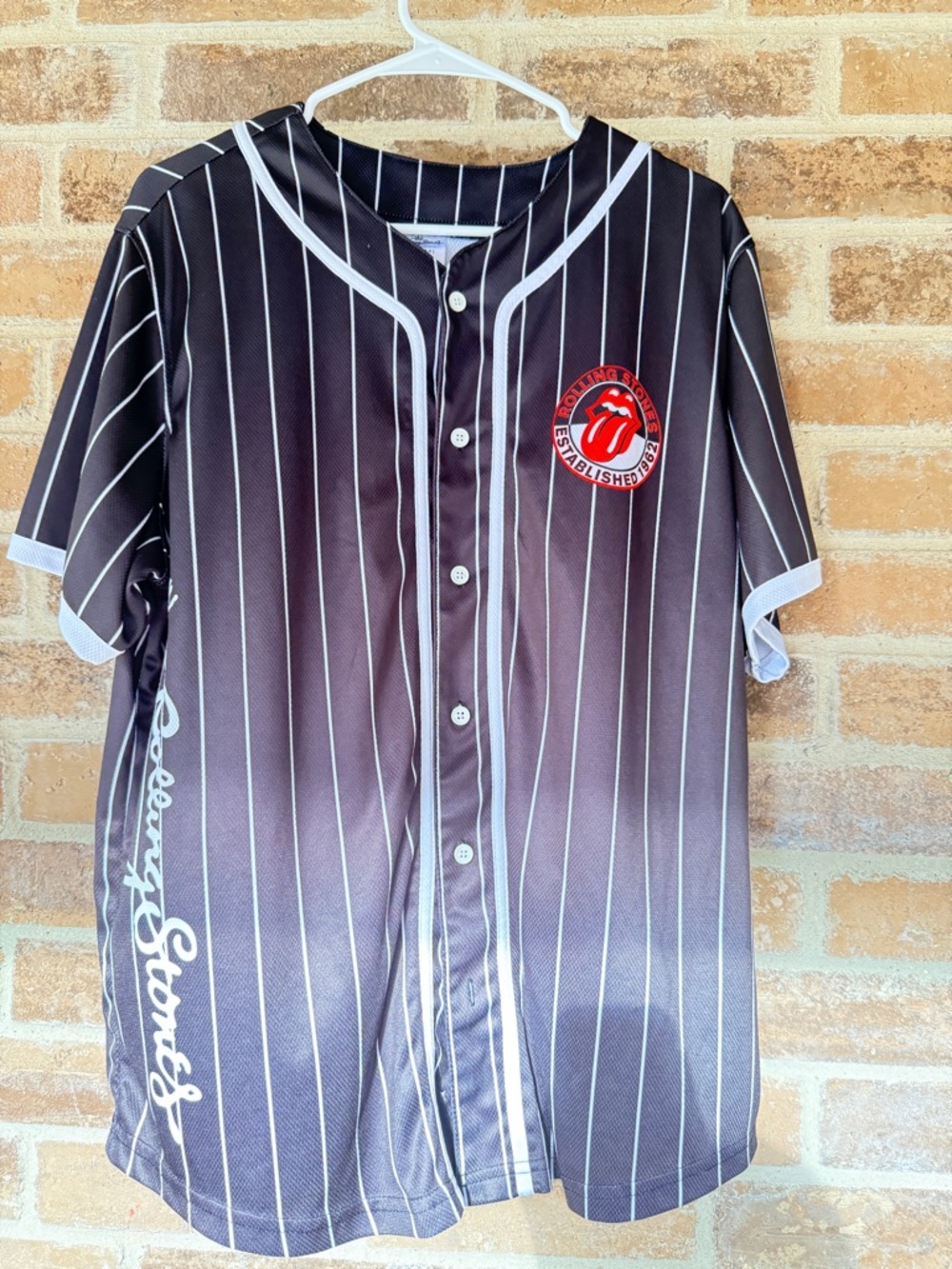 the Rolling Stones Black Jersey with White Pinstripes and Red Logo